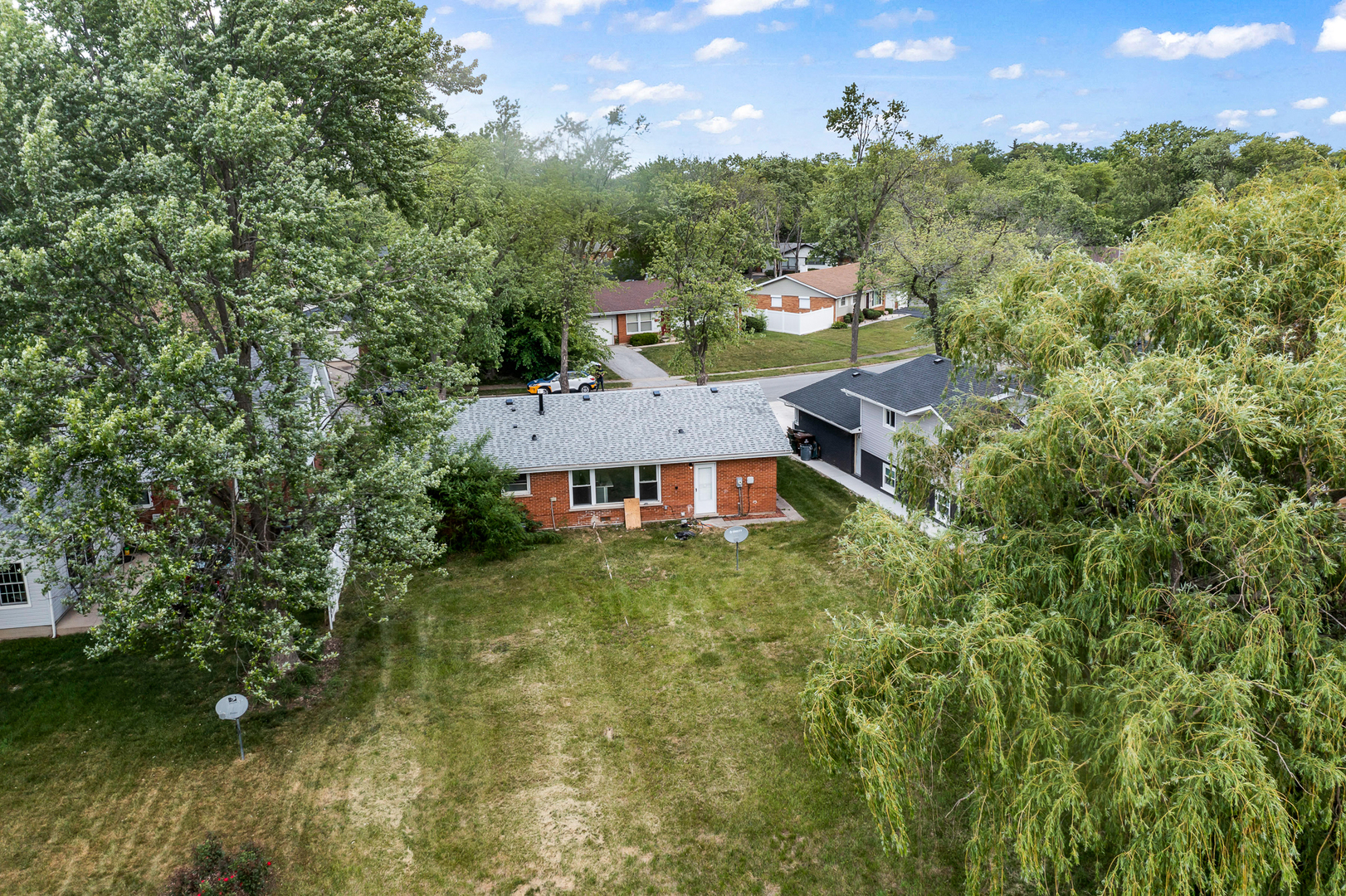 Undisclosed Address Hazel Crest, IL 60429 - Photo 19 of 23 an aerial view of a house with a yard