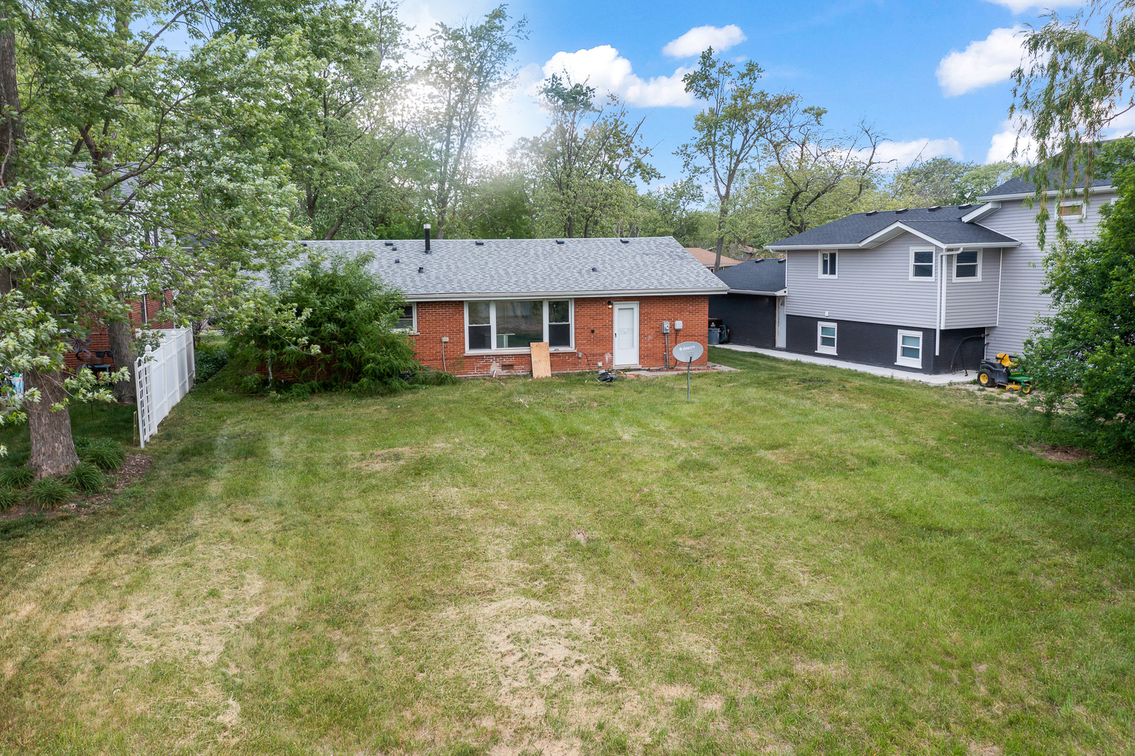 Undisclosed Address Hazel Crest, IL 60429 - Photo 20 of 23 a view of a house with a outdoor space
