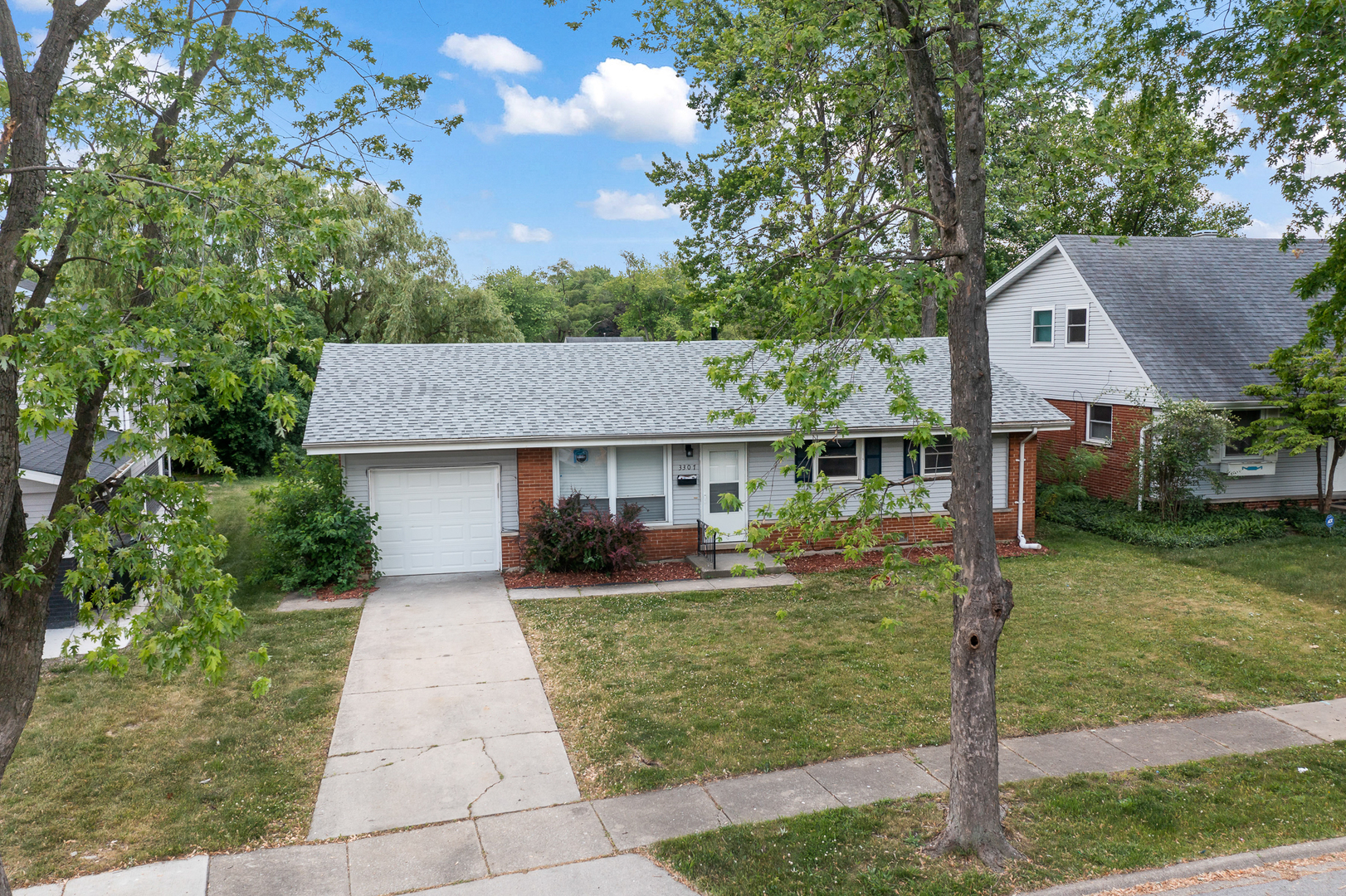 Undisclosed Address Hazel Crest, IL 60429 - Photo 2 of 23 a front view of a house with a yard