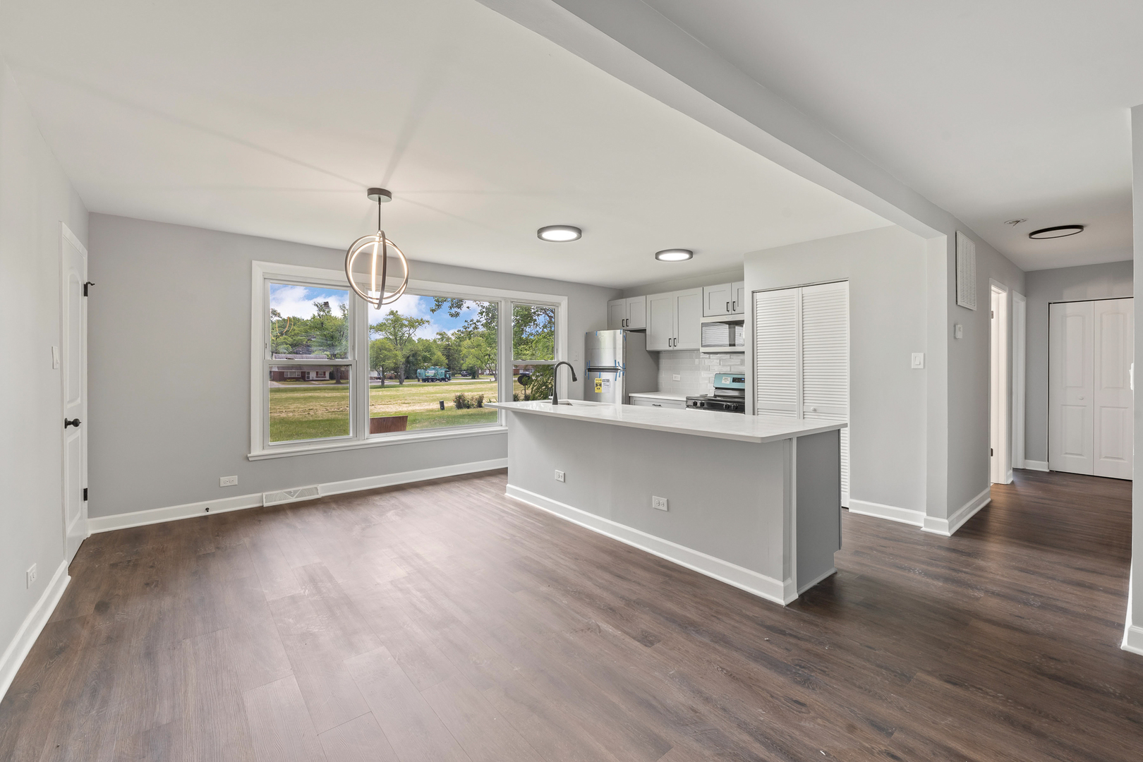 Undisclosed Address Hazel Crest, IL 60429 - Photo 6 of 23 a view of kitchen and refrigerator with wooden floor