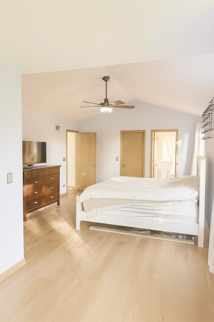 246 West Winding Trail Circle Round Lake, IL 60073 - Photo 19 of 26 a spacious bedroom with a bed and ceiling fan