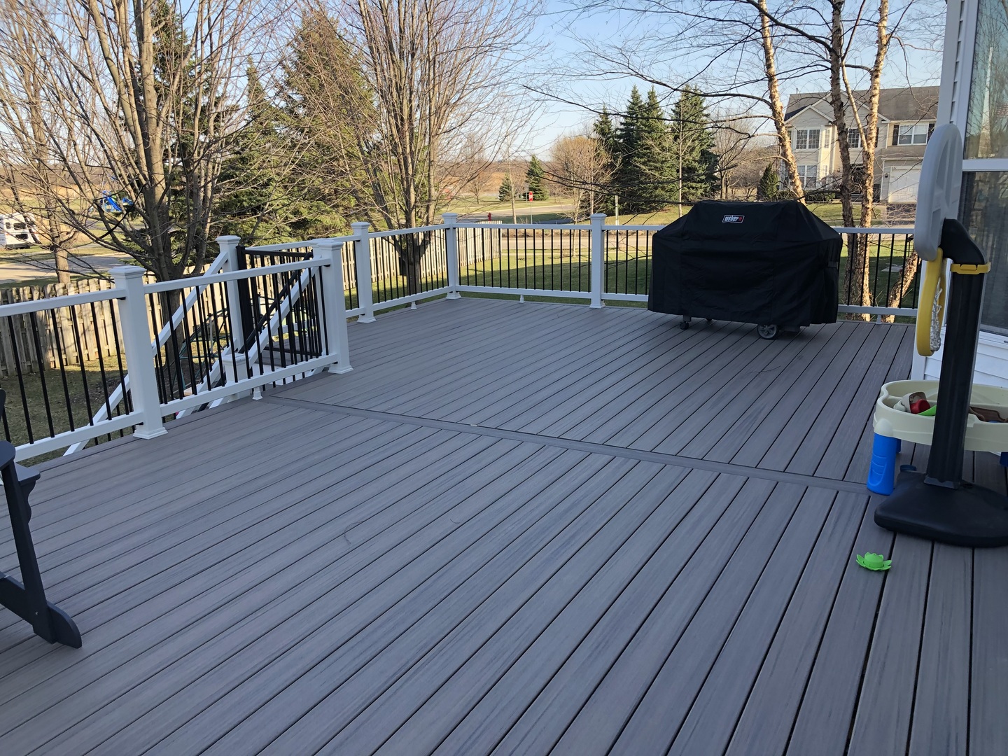 246 West Winding Trail Circle Round Lake, IL 60073 - Photo 24 of 26 a view of a deck with table and chairs with wooden floor and fence