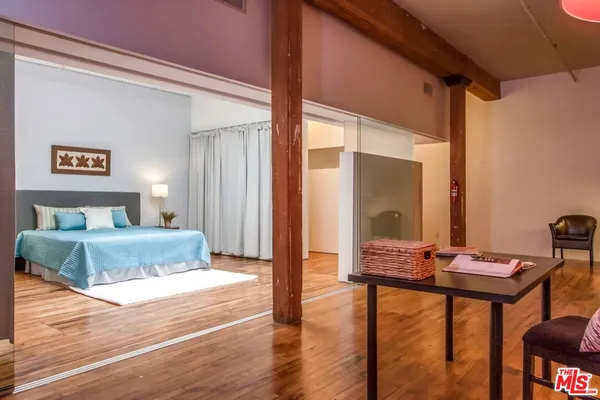 a bedroom with a bed and a view of bathroom