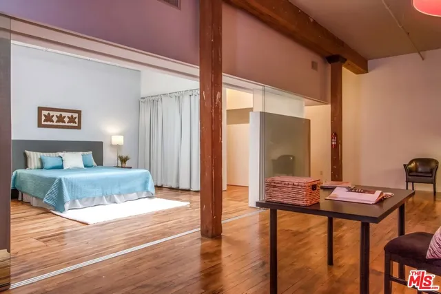 a bedroom with a bed and a view of bathroom