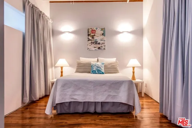 a living room with furniture a rug and a large window