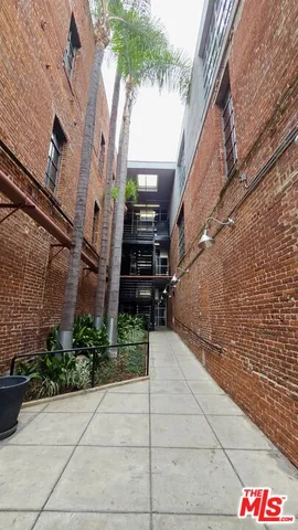 a picture of a bench in front of a wall