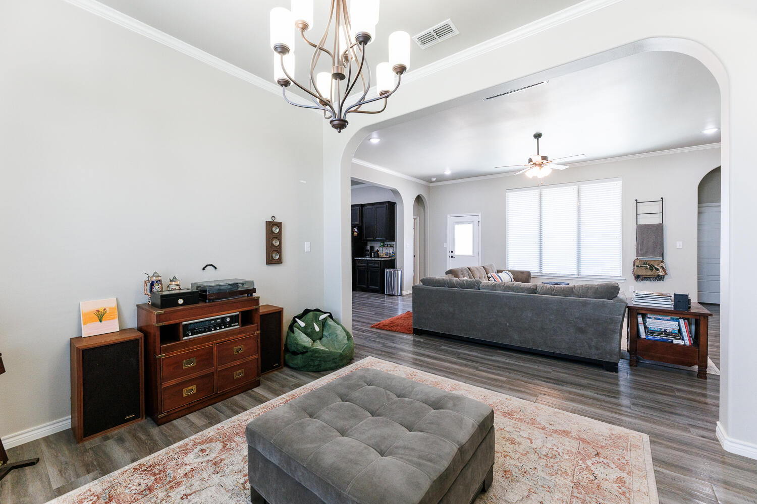 7619 59th Street Lubbock, TX 79407 - Photo 5 of 33 a living room with furniture and a wooden floor