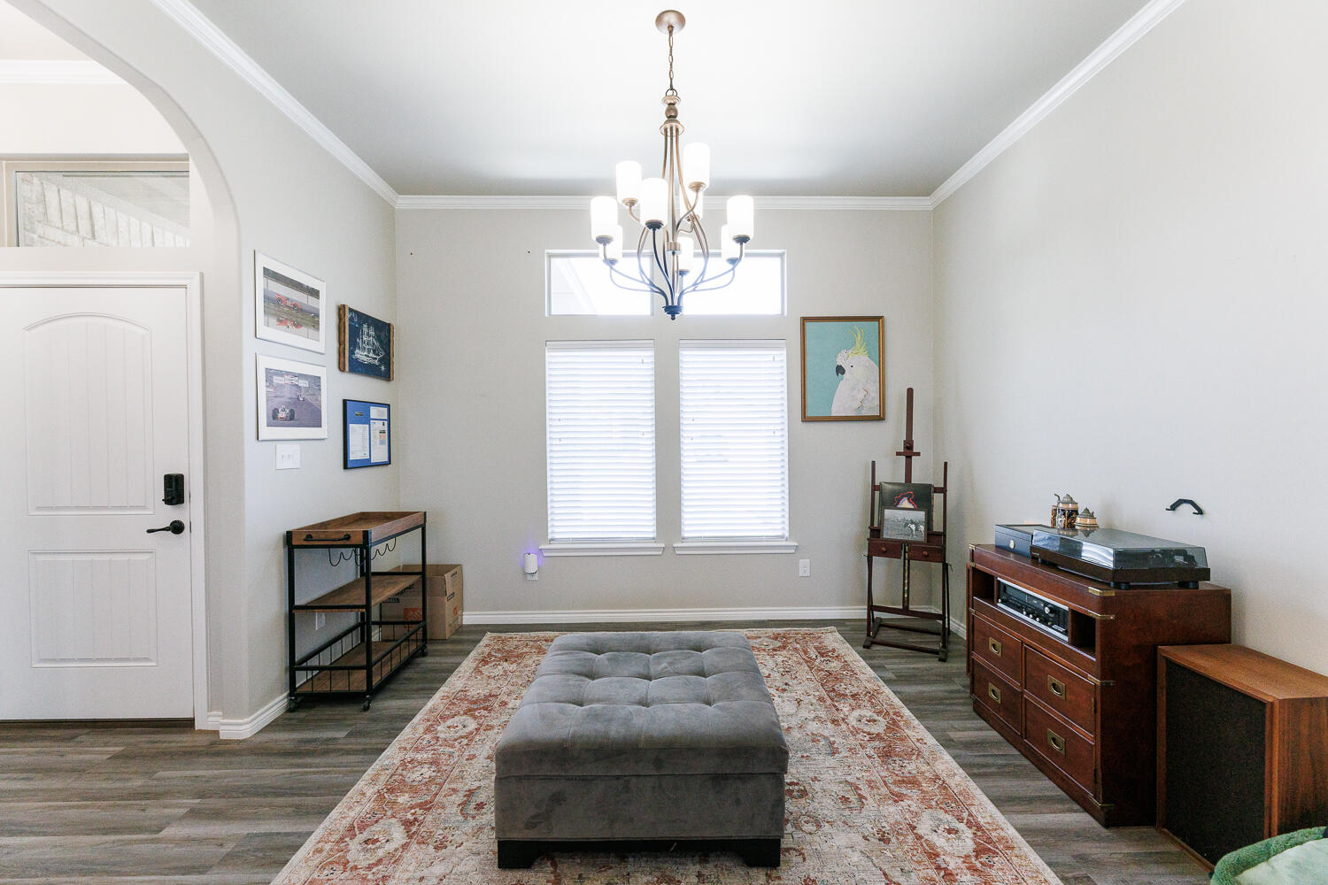 7619 59th Street Lubbock, TX 79407 - Photo 7 of 33 a bedroom with a bed and wooden floor