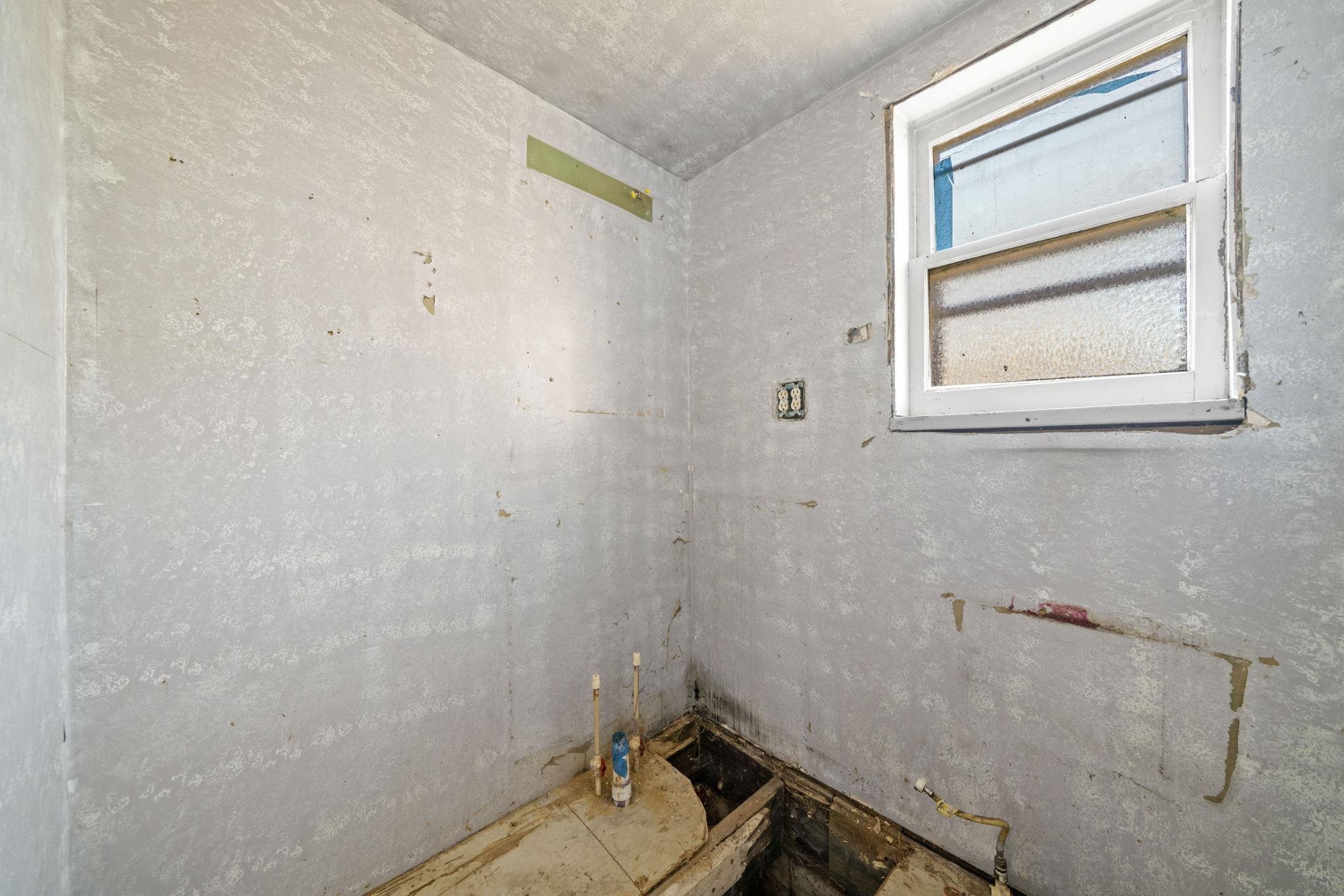 1884 Will James Road Rockford, IL 61109 - Photo 12 of 26 a bathroom with a sink and a window