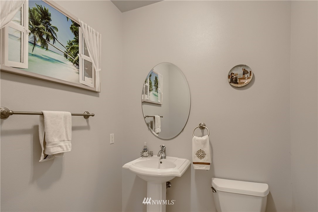 2750 Diamond Loop, Unit E Milton, WA 98354 - Photo 11 of 13 a bathroom with a sink mirror and toilet