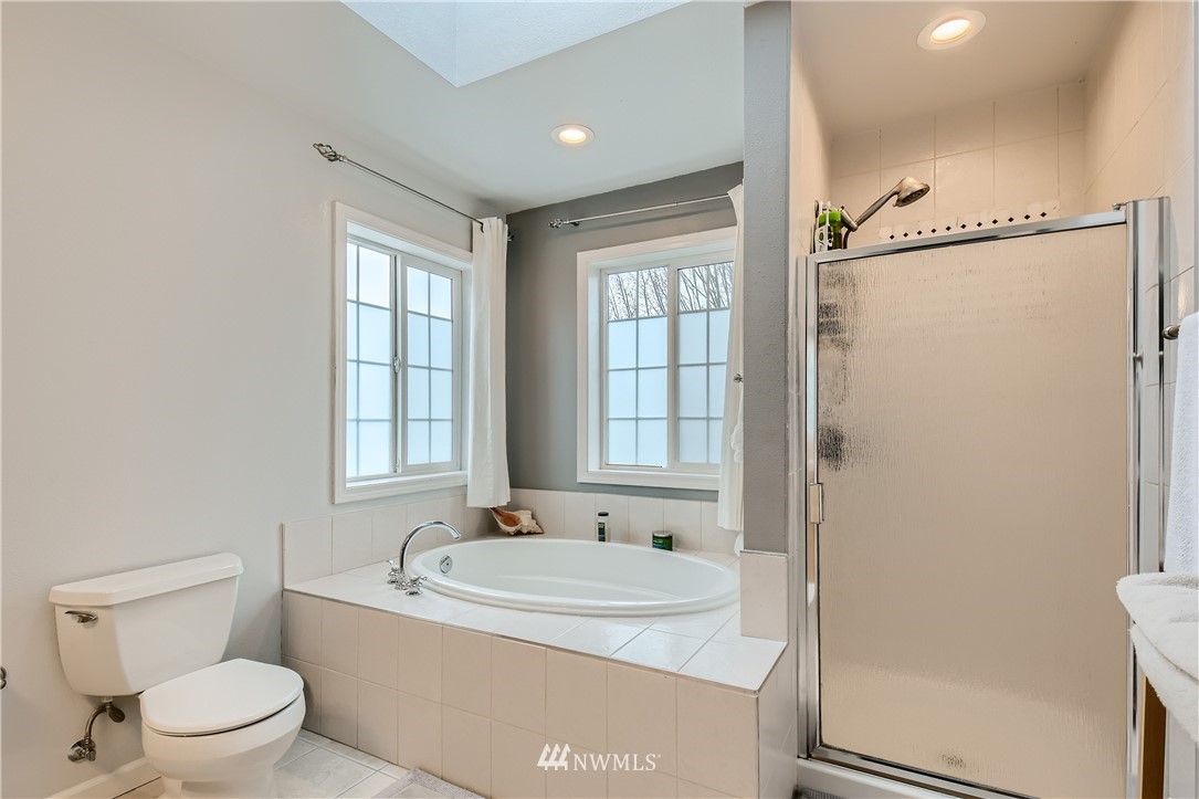 2750 Diamond Loop, Unit E Milton, WA 98354 - Photo 3 of 13 a bathroom with a granite countertop sink toilet and shower