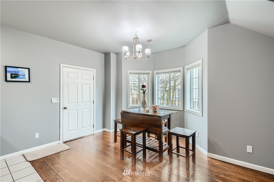 2750 Diamond Loop, Unit E Milton, WA 98354 - Photo 4 of 13 a view of a dining room with furniture window and wooden floor