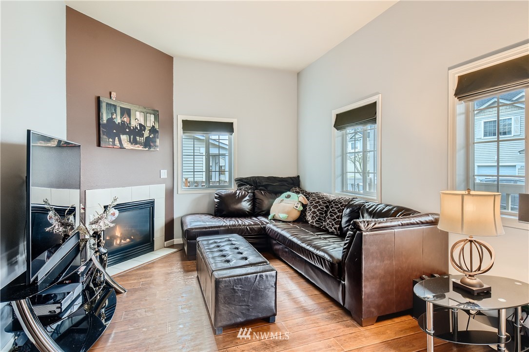 2750 Diamond Loop, Unit E Milton, WA 98354 - Photo 5 of 13 a living room with furniture a flat screen tv and a window