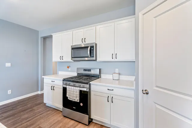 a kitchen with sink and cabinets