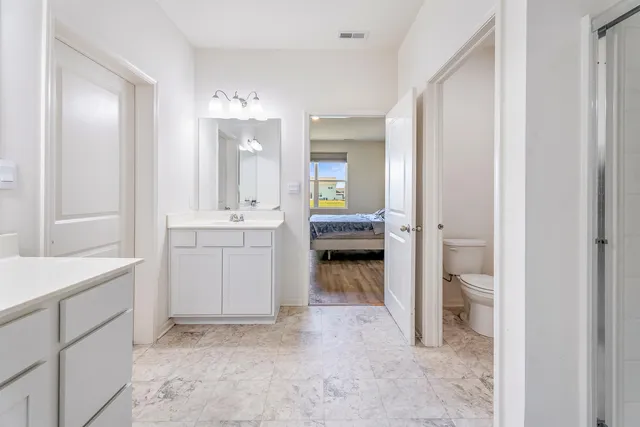 a bathroom with a sink and shower