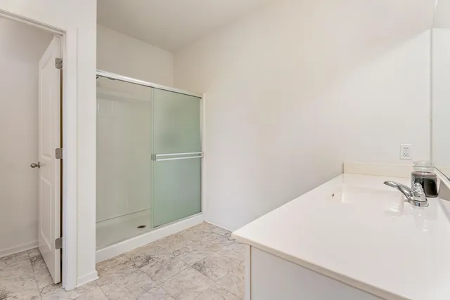 a bathroom with a sink vanity and a mirror