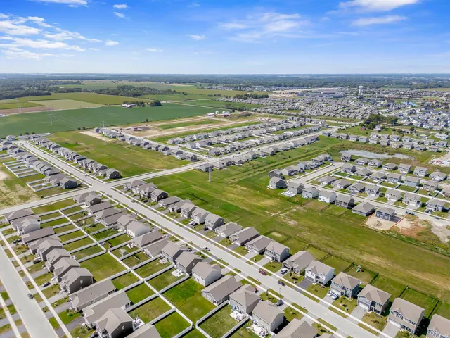 a view of building with yard and ocean view