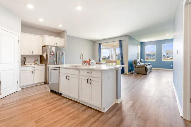 a kitchen with cabinets and white appliances