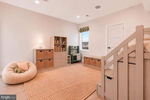 a view of a bedroom with furniture