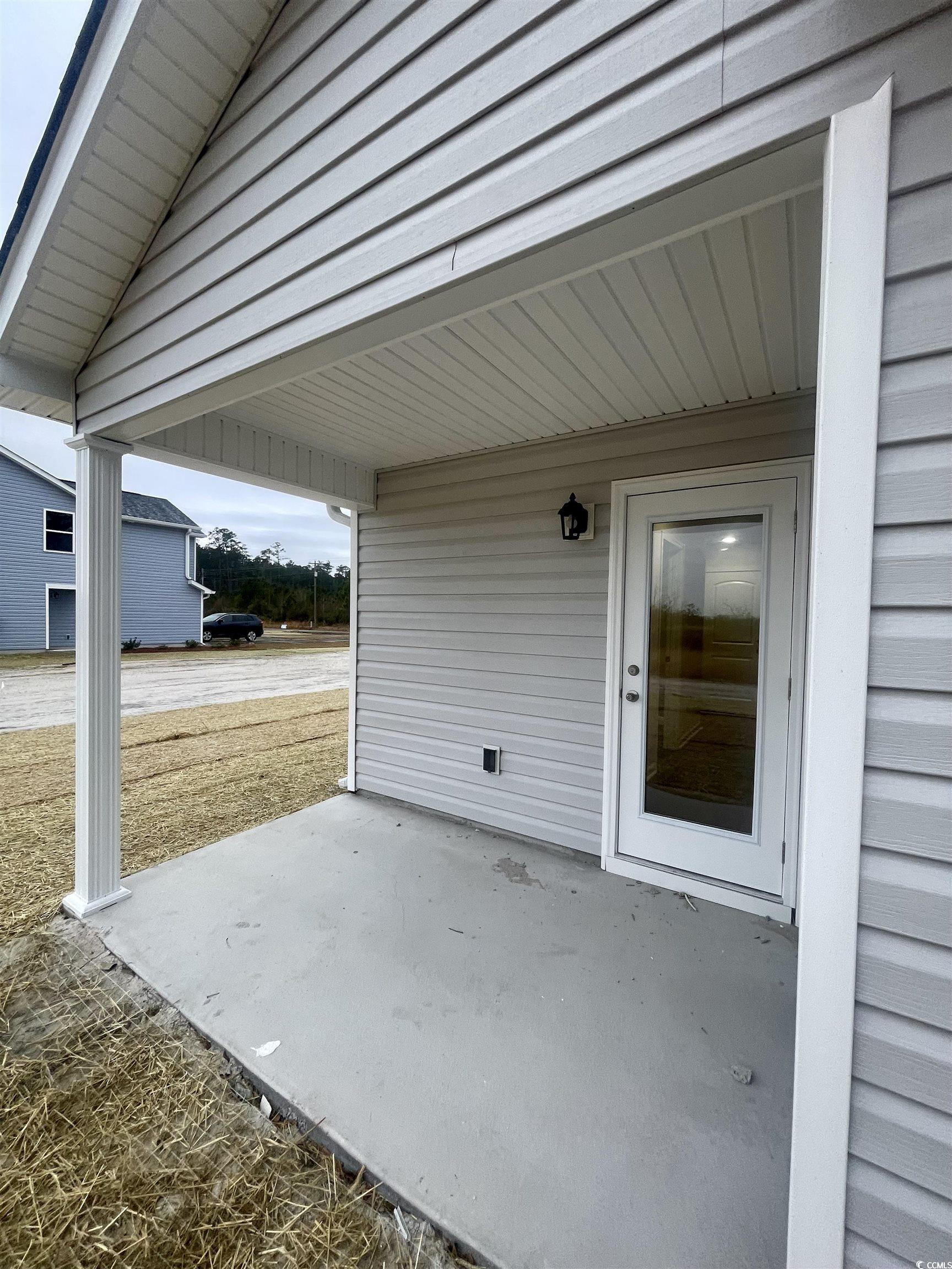 761 Busy Corner Road Conway, SC 29527 - Photo 24 of 37 Utility room featuring water heater