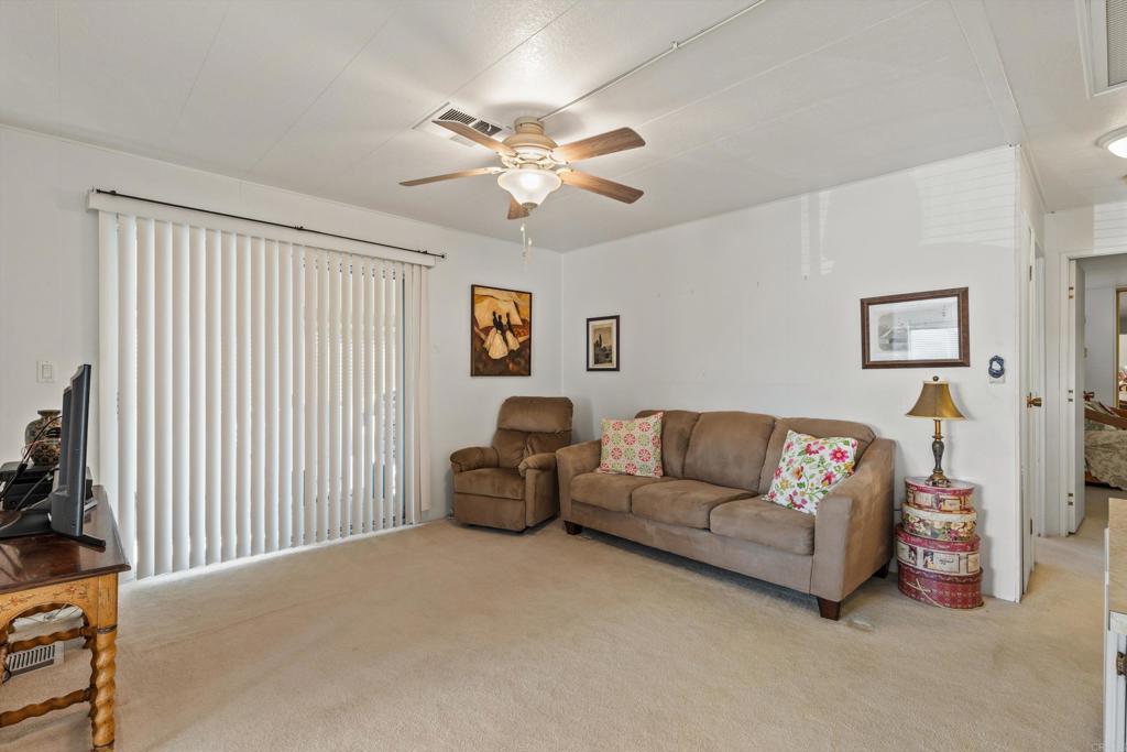 650 South Rancho Santa Fe Road, Unit 256 San Marcos, CA 92078 - Photo 14 of 60 a living room with furniture and a window