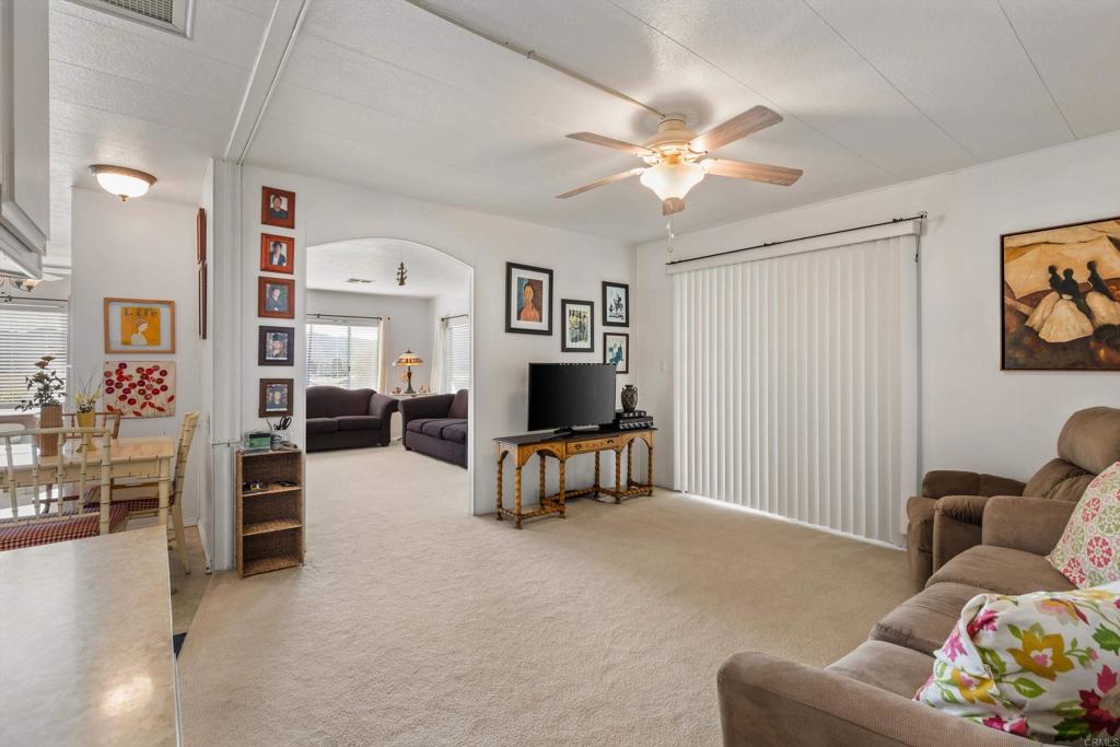 650 South Rancho Santa Fe Road, Unit 256 San Marcos, CA 92078 - Photo 15 of 60 a living room with furniture and a flat screen tv
