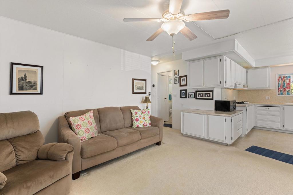 650 South Rancho Santa Fe Road, Unit 256 San Marcos, CA 92078 - Photo 16 of 60 a living room with furniture and a couch