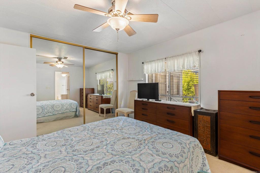 650 South Rancho Santa Fe Road, Unit 256 San Marcos, CA 92078 - Photo 18 of 60 a bedroom with a bed and a dresser