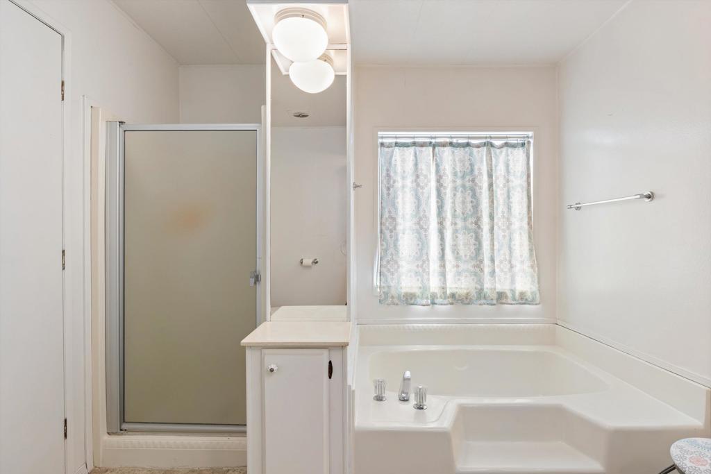 650 South Rancho Santa Fe Road, Unit 256 San Marcos, CA 92078 - Photo 21 of 60 a bathroom with a bathtub and shower