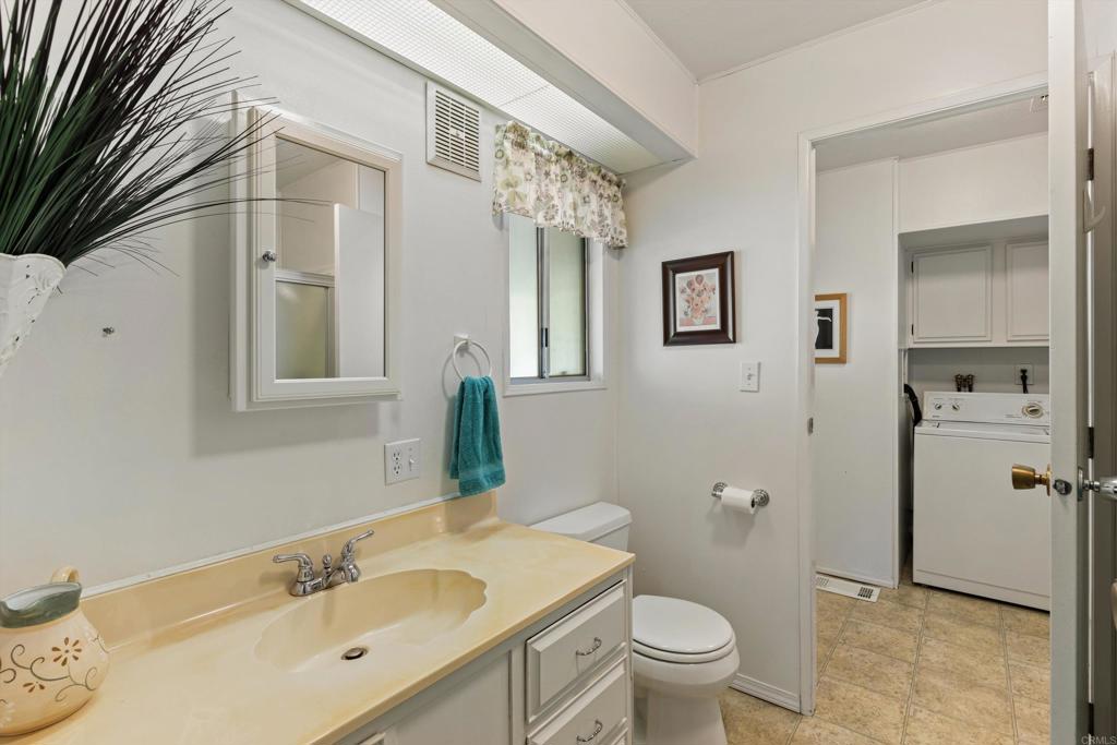 650 South Rancho Santa Fe Road, Unit 256 San Marcos, CA 92078 - Photo 24 of 60 a bathroom with a sink a toilet and shower