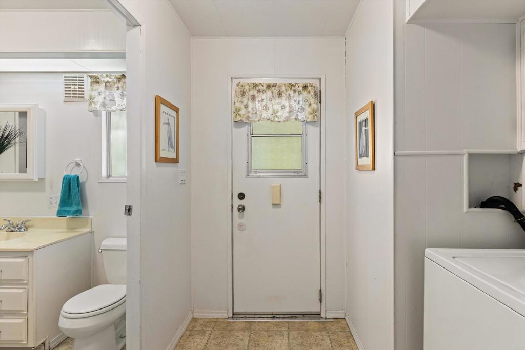 650 South Rancho Santa Fe Road, Unit 256 San Marcos, CA 92078 - Photo 27 of 60 a bathroom with a toilet a sink and shower