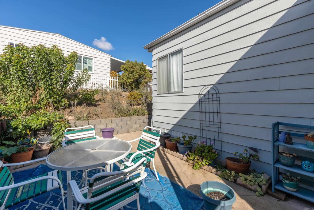 650 South Rancho Santa Fe Road, Unit 256 San Marcos, CA 92078 - Photo 28 of 60 a outdoor dining space with furniture and potted plants