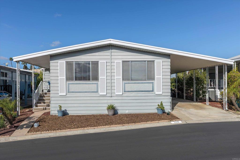 650 South Rancho Santa Fe Road, Unit 256 San Marcos, CA 92078 - Photo 34 of 60 a front view of a house with a yard