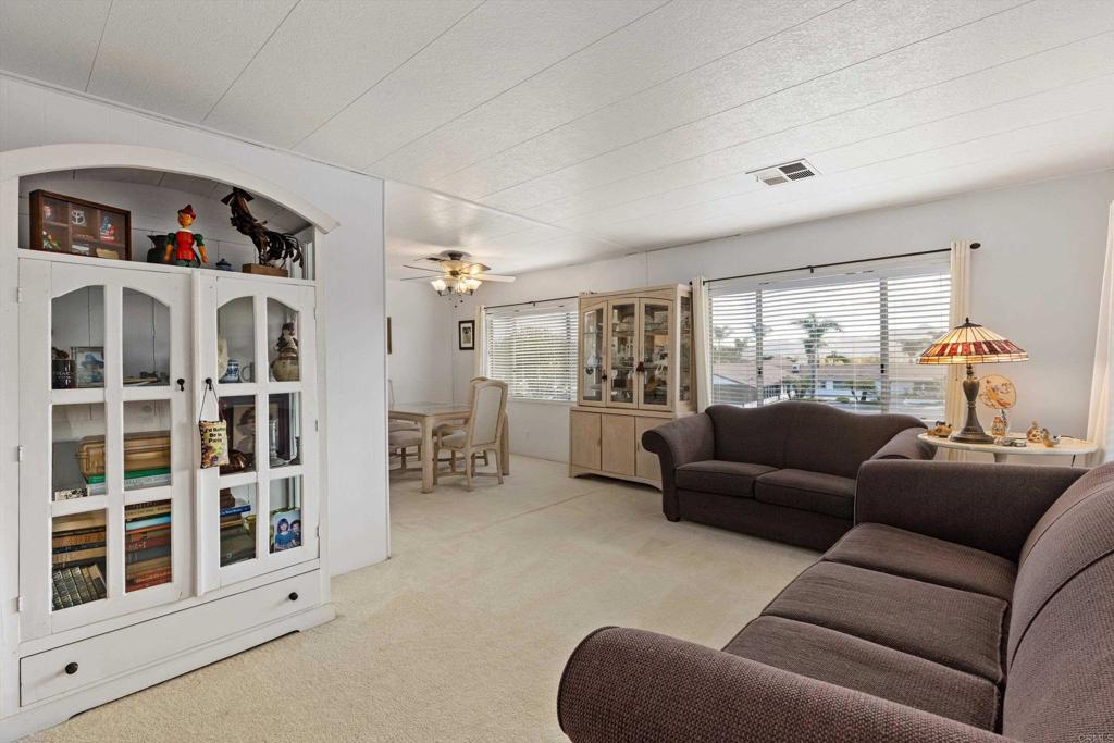 650 South Rancho Santa Fe Road, Unit 256 San Marcos, CA 92078 - Photo 4 of 60 a living room with furniture and a window