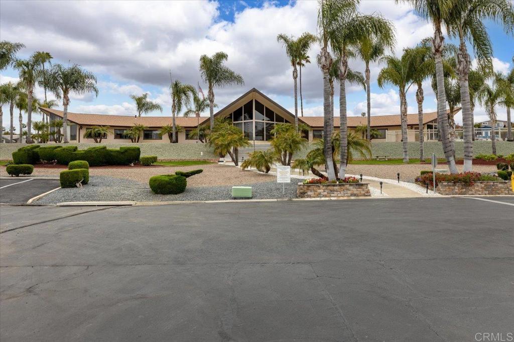 650 South Rancho Santa Fe Road, Unit 256 San Marcos, CA 92078 - Photo 46 of 60 a row of palm trees and a fire pit
