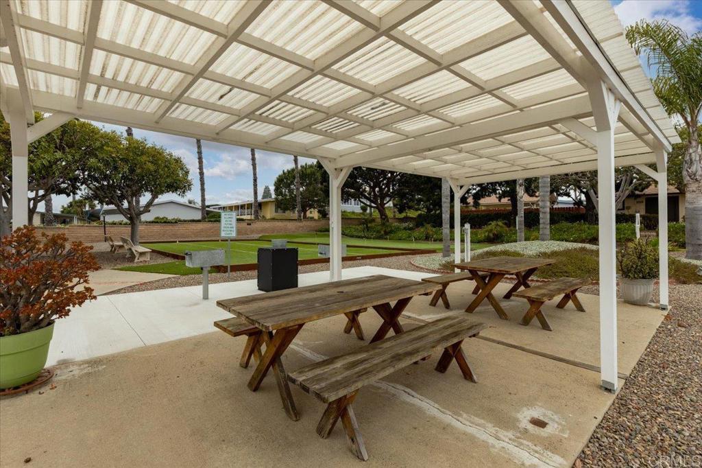 650 South Rancho Santa Fe Road, Unit 256 San Marcos, CA 92078 - Photo 54 of 60 a building outdoor space with patio furniture and potted plants
