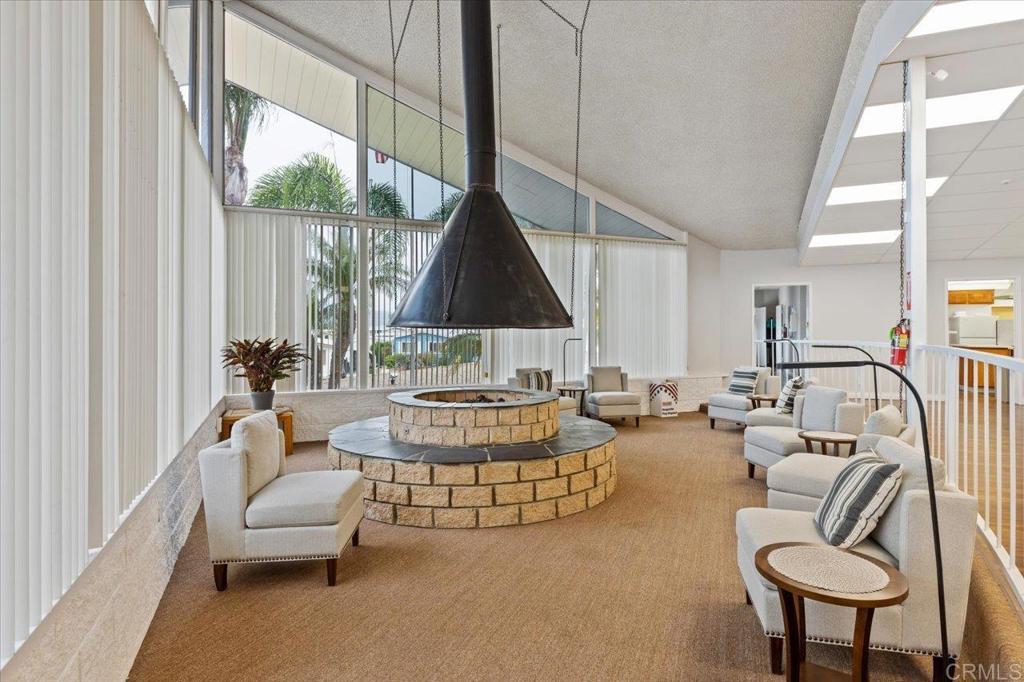 650 South Rancho Santa Fe Road, Unit 256 San Marcos, CA 92078 - Photo 55 of 60 a living room with fireplace furniture and a large window