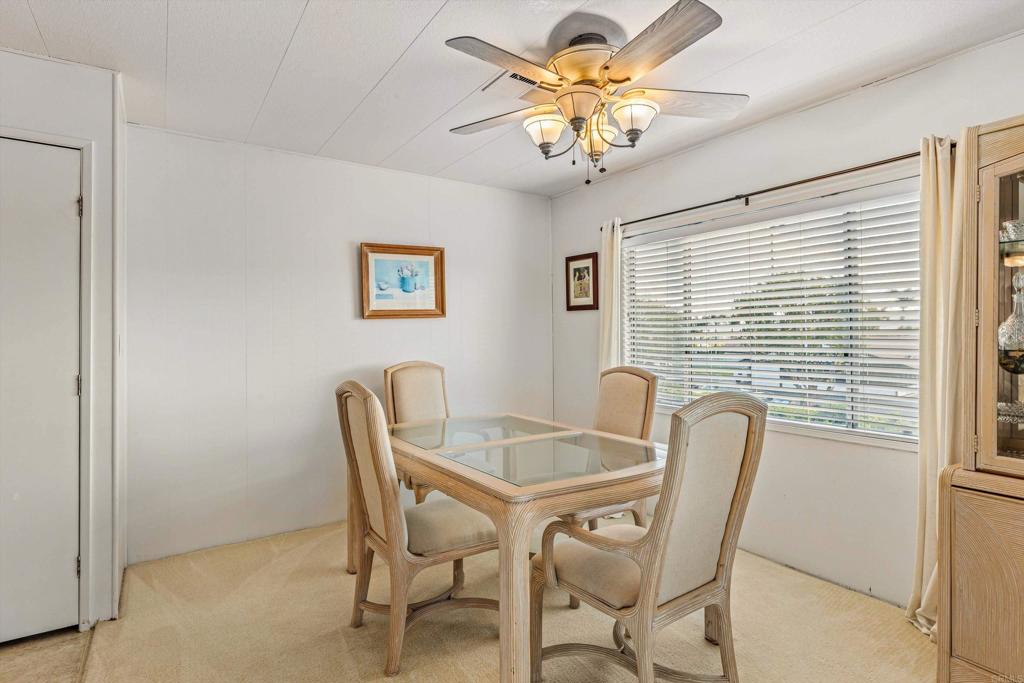 650 South Rancho Santa Fe Road, Unit 256 San Marcos, CA 92078 - Photo 6 of 60 a view of a dining room with furniture and chandelier