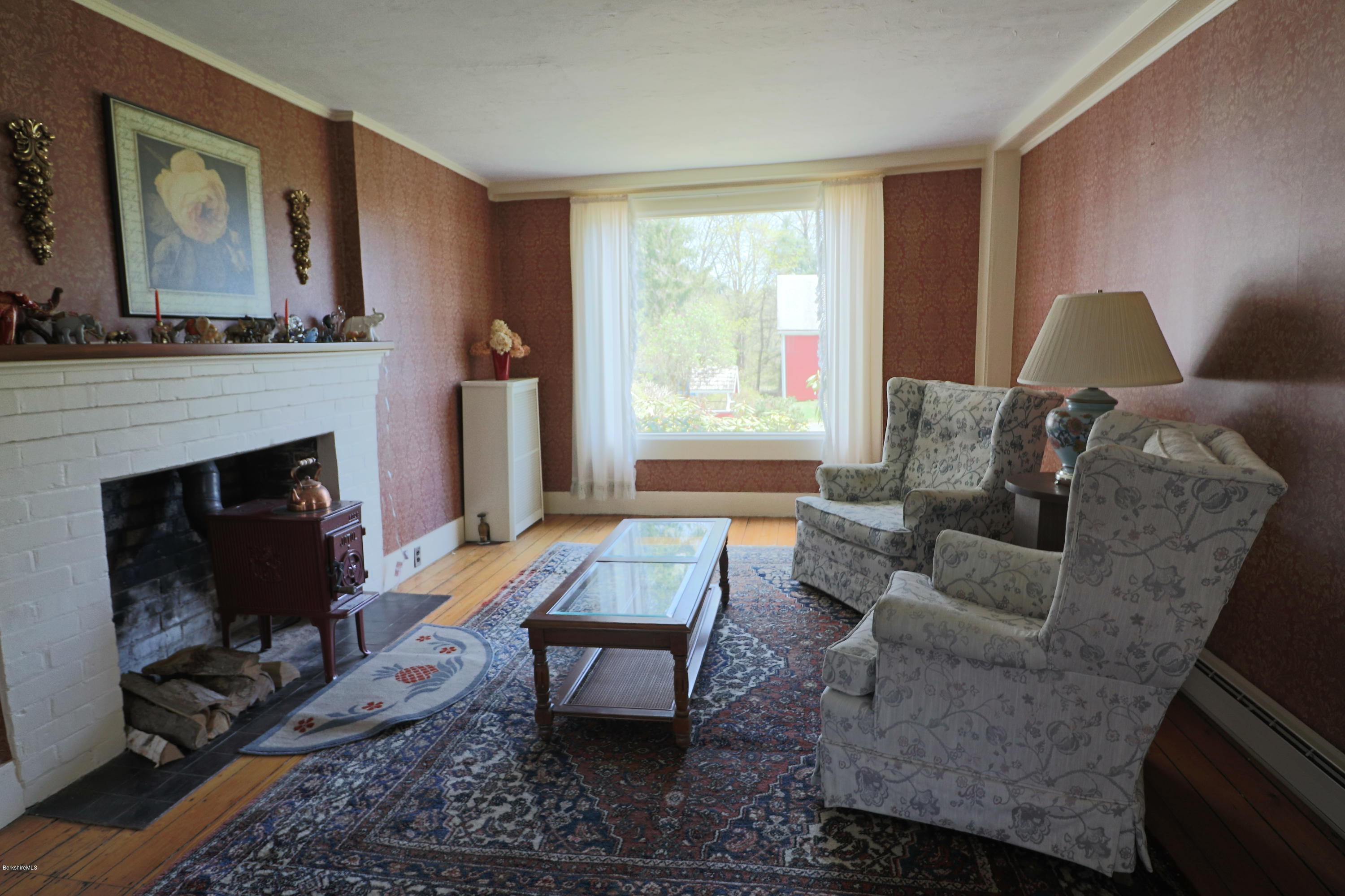 22 Summit Road Richmond, MA 01254 - Photo 11 of 52 a living room with furniture and a fireplace