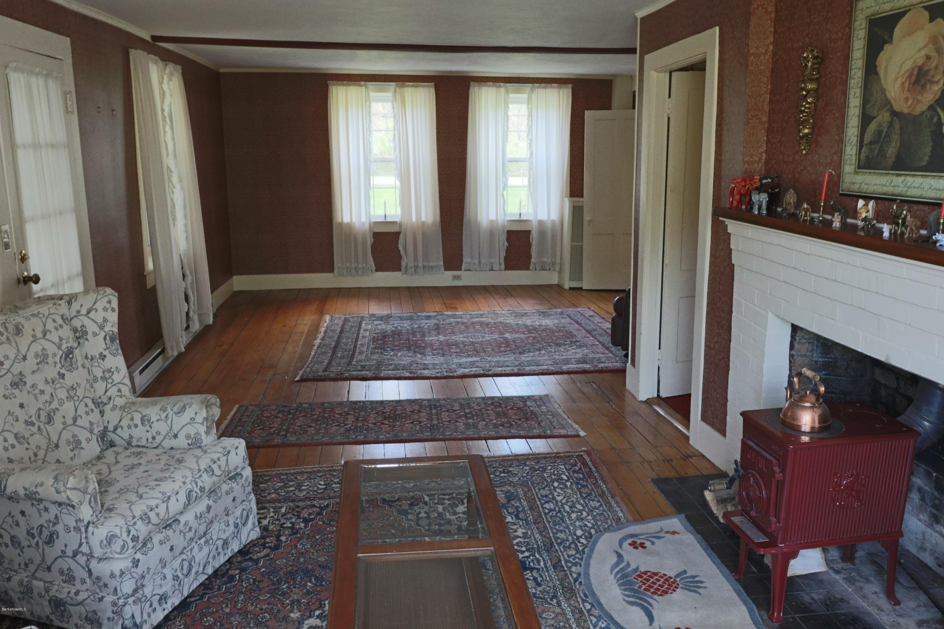 22 Summit Road Richmond, MA 01254 - Photo 13 of 52 a living room with furniture and a fireplace