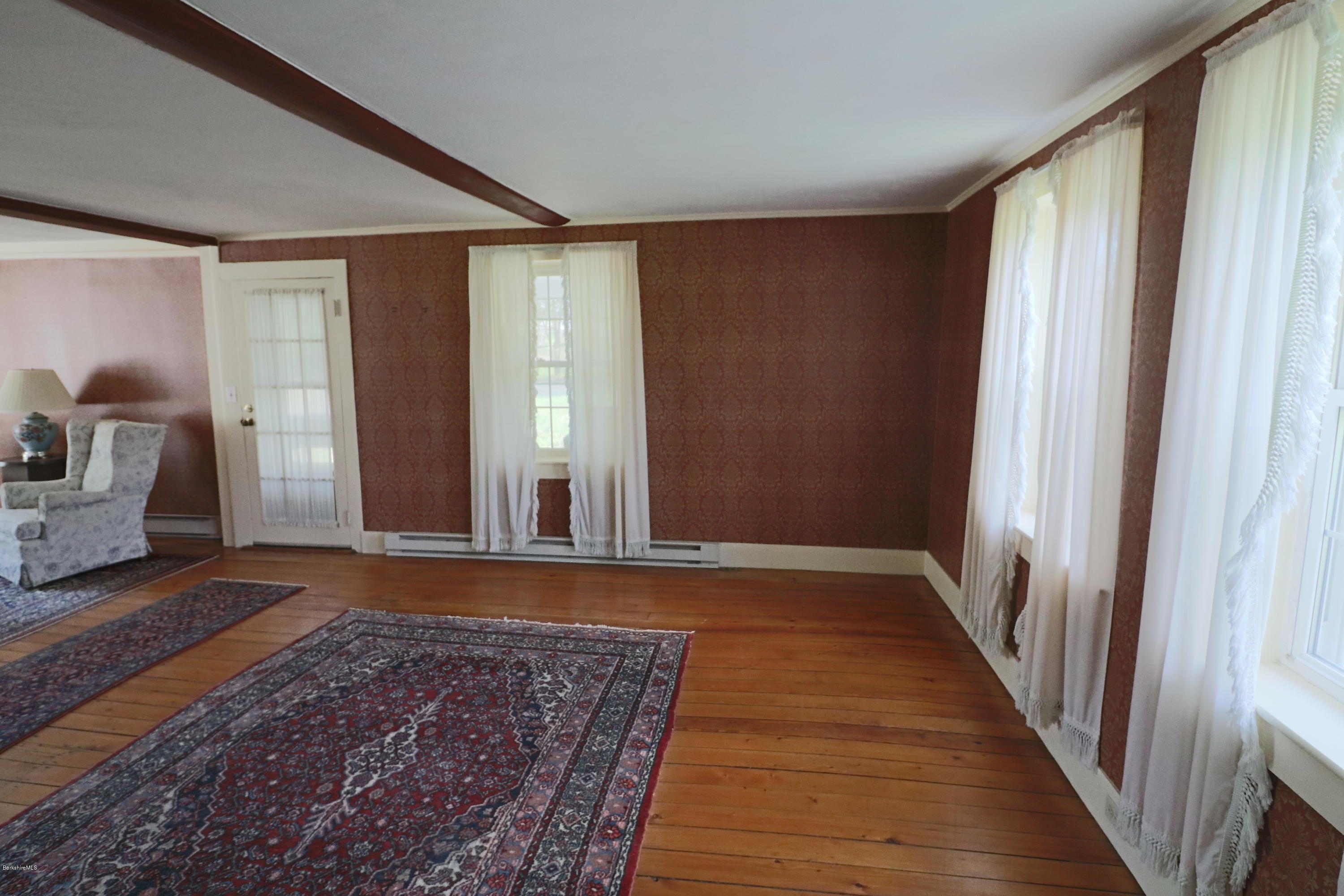 22 Summit Road Richmond, MA 01254 - Photo 14 of 52 a view of a room with a large window and wooden floor