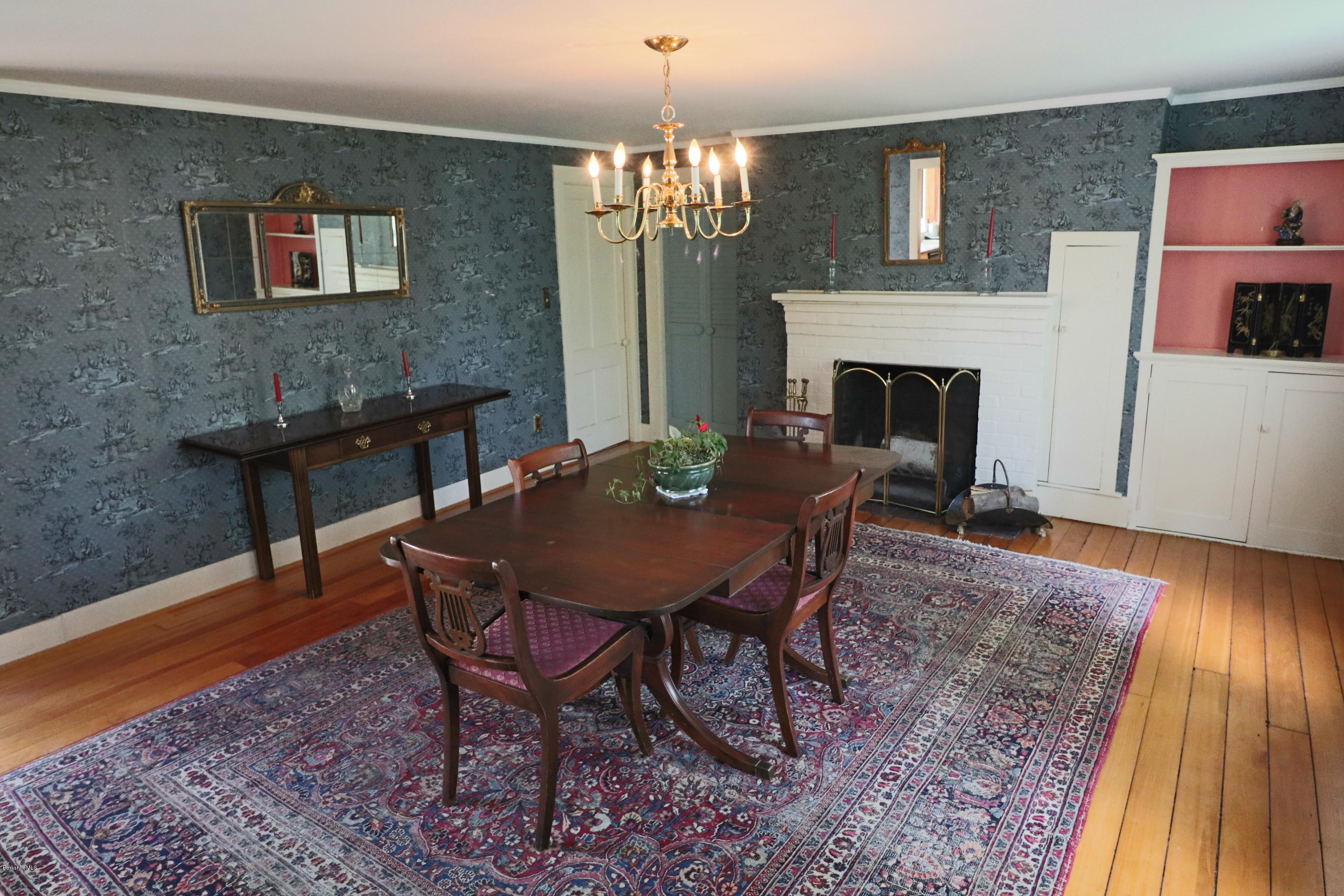 22 Summit Road Richmond, MA 01254 - Photo 19 of 52 a view of a dining room with furniture and a chandelier