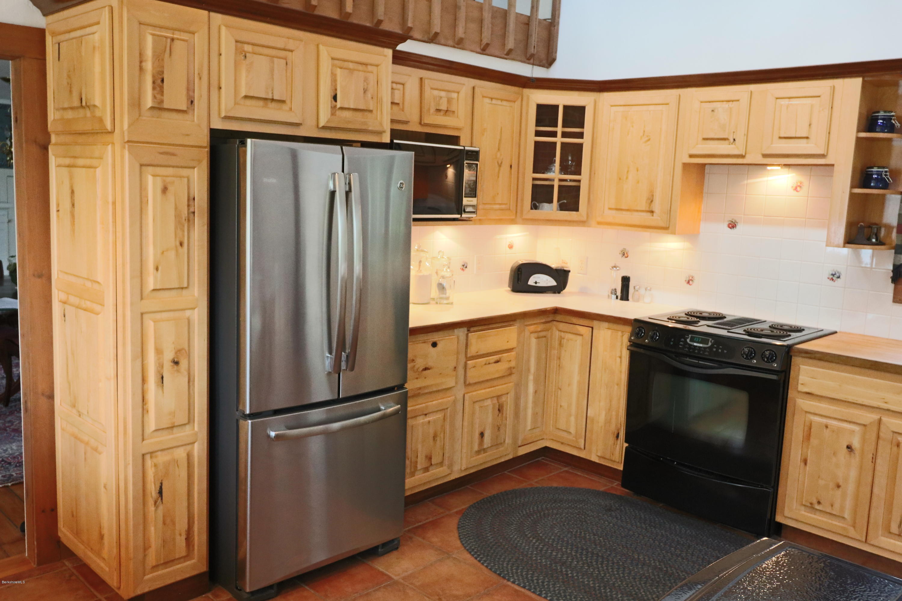 22 Summit Road Richmond, MA 01254 - Photo 24 of 52 a kitchen with stainless steel appliances granite countertop a refrigerator stove and sink