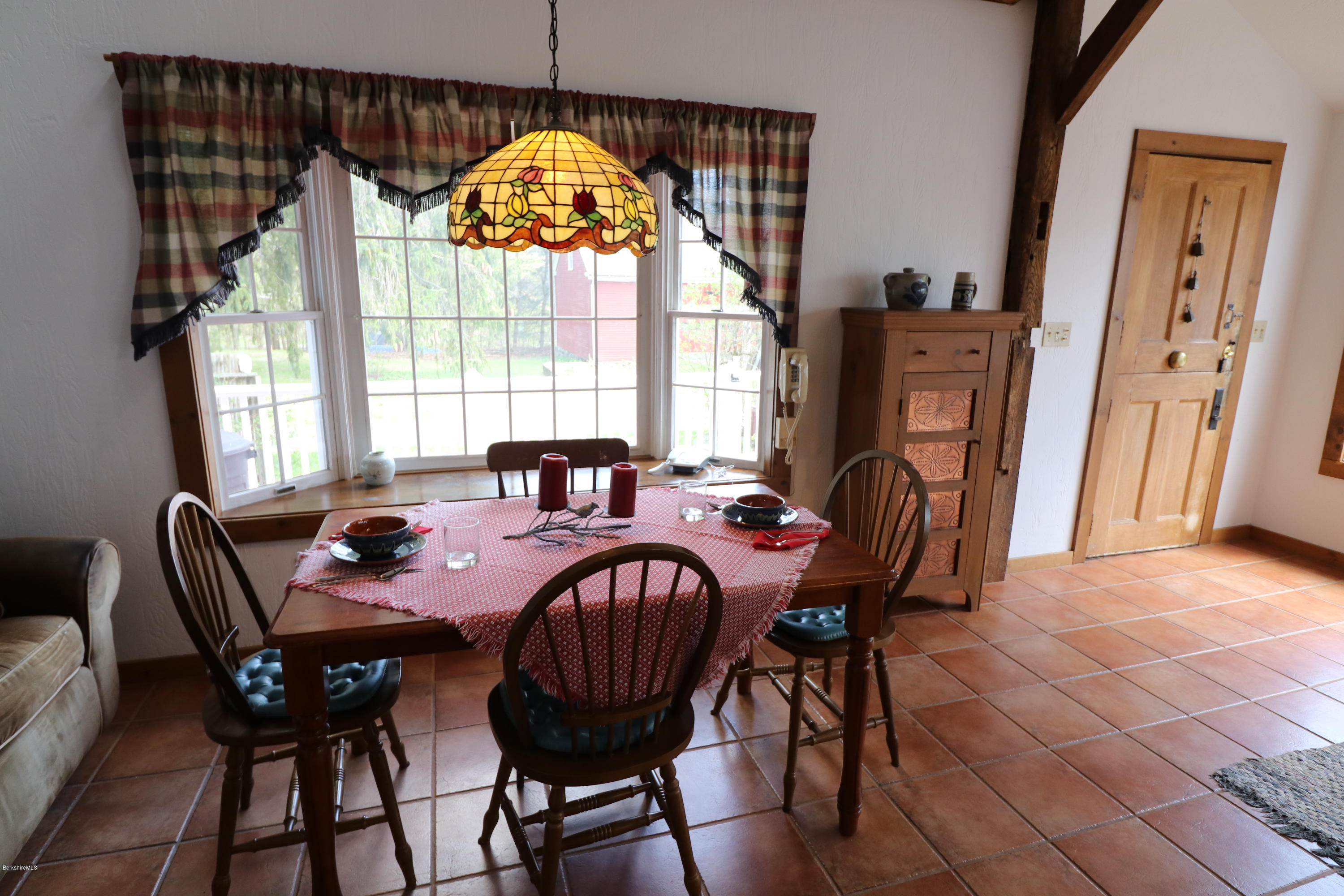 22 Summit Road Richmond, MA 01254 - Photo 31 of 52 a dining room with furniture a chandelier and wooden floor