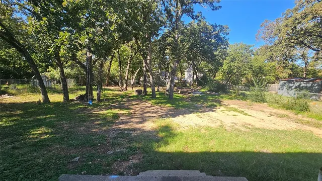 a view of outdoor space with trees all around