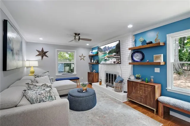 a living room with furniture and a fireplace