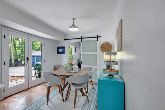 a view of a dining room with furniture and window