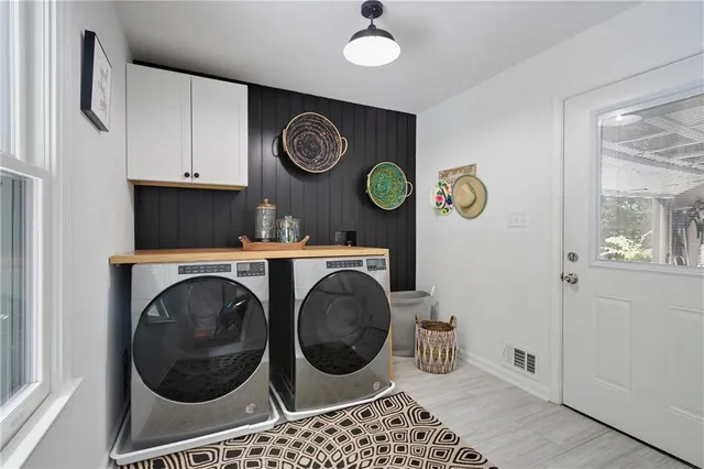 a view of a storage & utility room with a washer and dryer