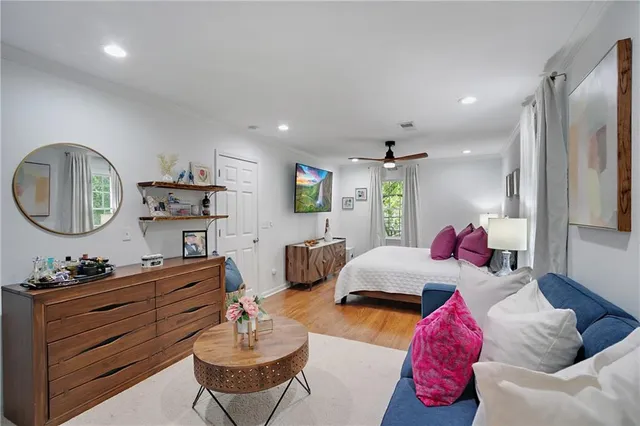 a living room with furniture and a mirror
