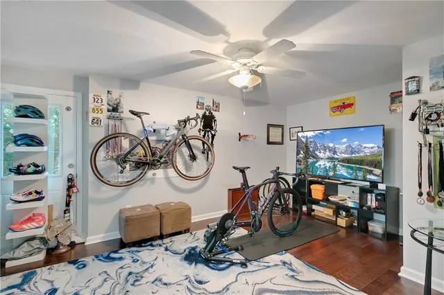 a view of a livingroom with furniture and a flat screen tv